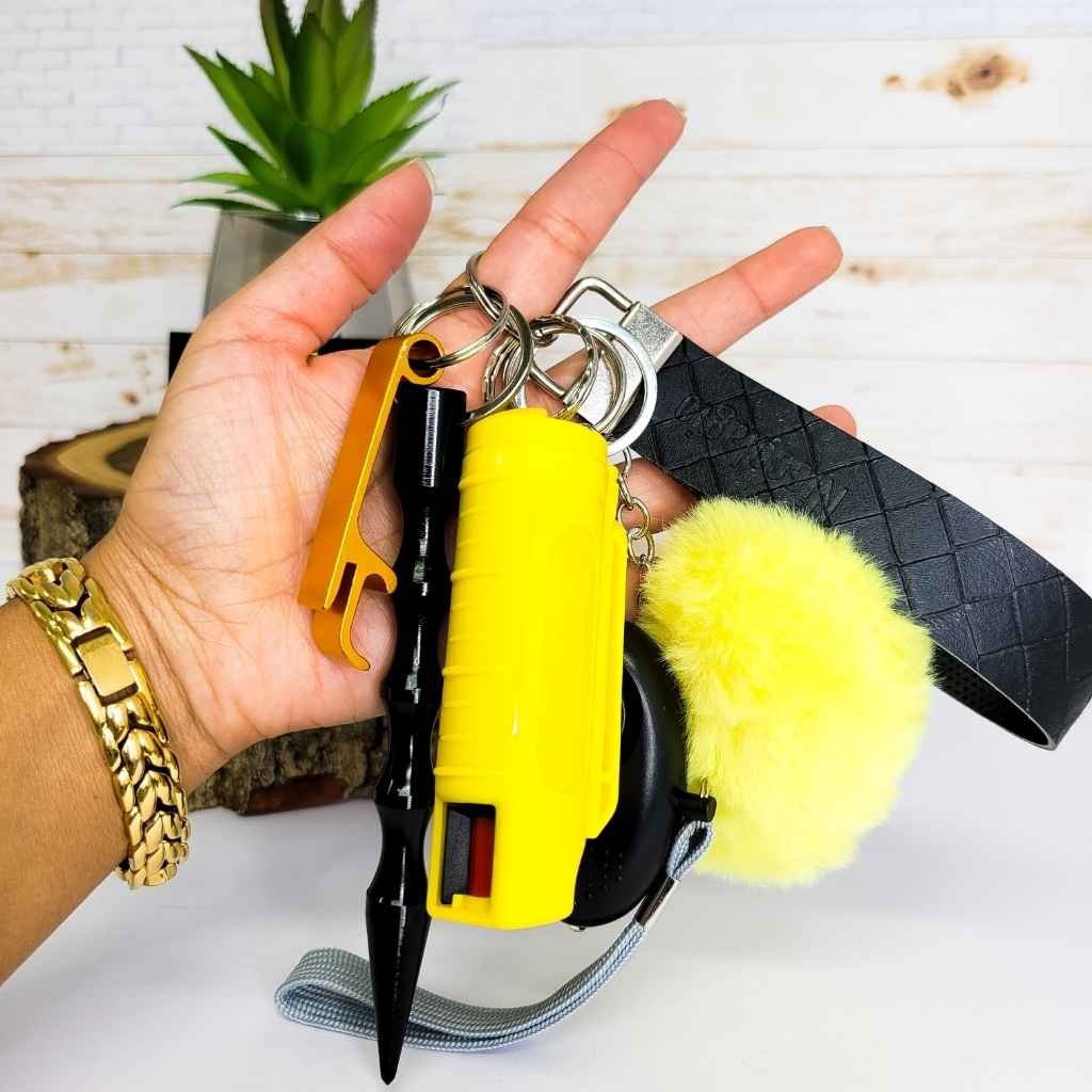 Black and yellow self defense keychain for women, beautiful self defense keychain, yellow pepper spray, kubaton. ideal for woman's safety; self defense keychain with stun gun; ideas for women safety; importance of women safety; self defense clases; self defense kits; women self defense; self defense products for women; self defense keychain set; self defense keychain with taiser; safety razor for women; women safety; safety devices for women; custom keychains; key chains amazon;